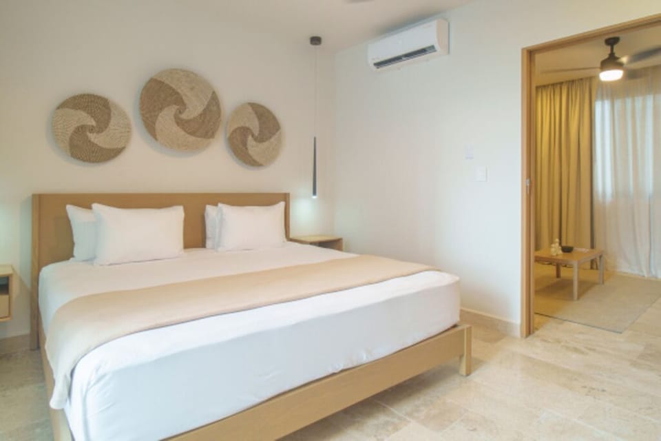 Stretch out in a serene bedroom with warm, minimalist design.