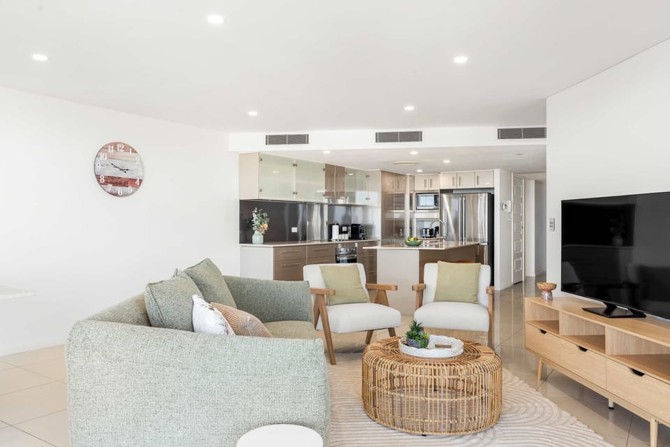 Inviting living space with comfortable sofas and ocean inspired atmosphere