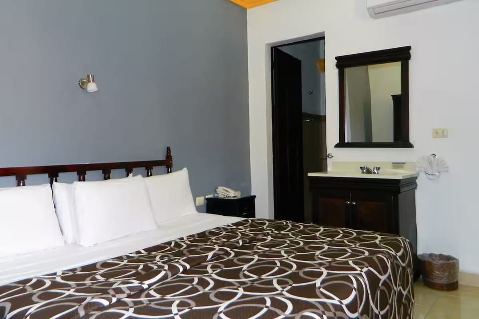 Stretch out on a cozy king bed beside convenient vanity.