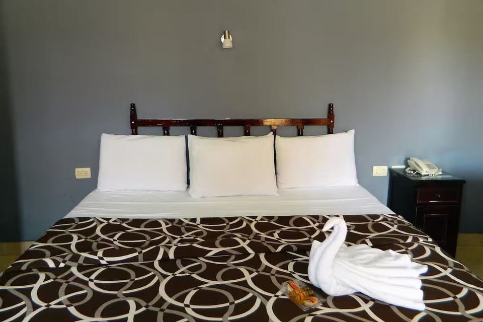 Sink into plush pillows and enjoy thoughtful towel art touches.