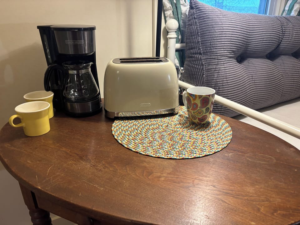 Coffee maker, toaster, mugs & sweetener provided