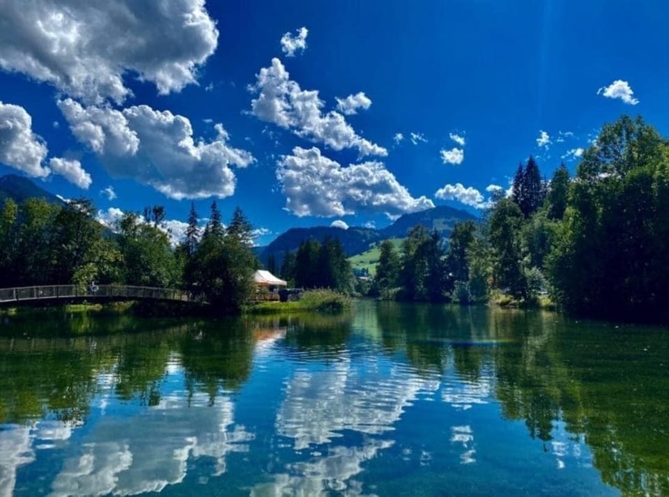 Stunning lake reflections under a bright blue sky