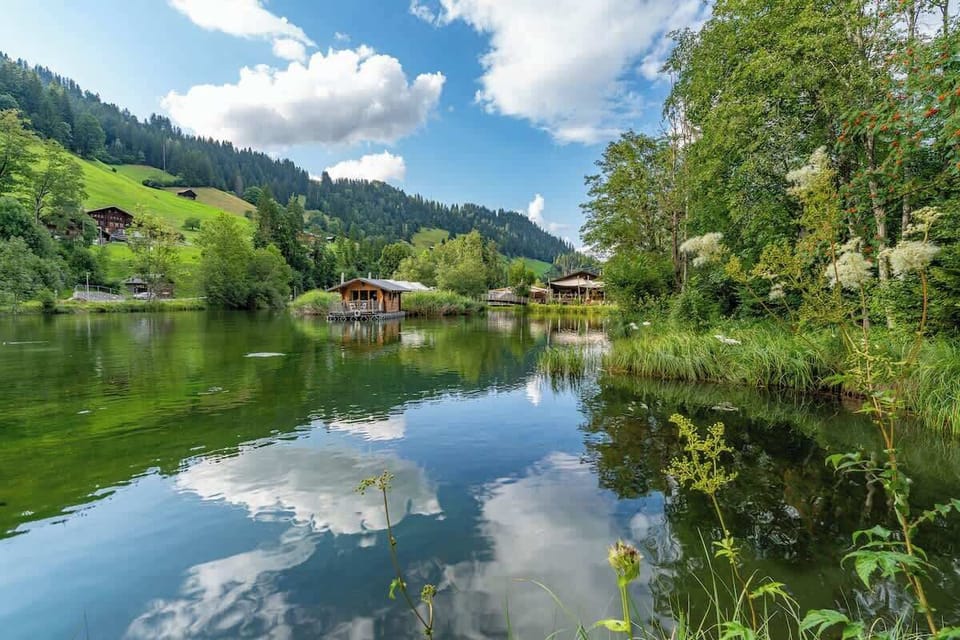 Crystal-clear lake reflecting the surrounding mountains
