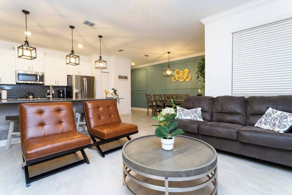 Open living space that seamlessly connects the kitchen and dining area, offering a perfect blend of comfort and style.