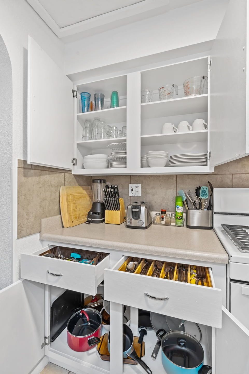 Your bright, organized kitchen comes fully equipped with everything you need to whip up your favorite meals—from fresh coffee in the morning to home-cooked dinners.