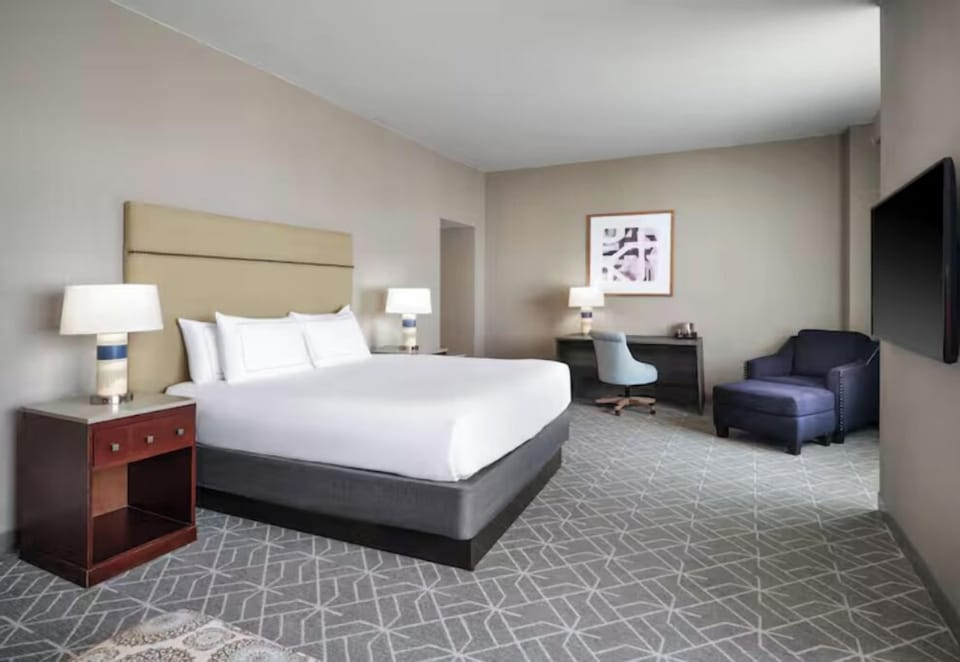 Recharge in a spacious king room with dedicated workspace.