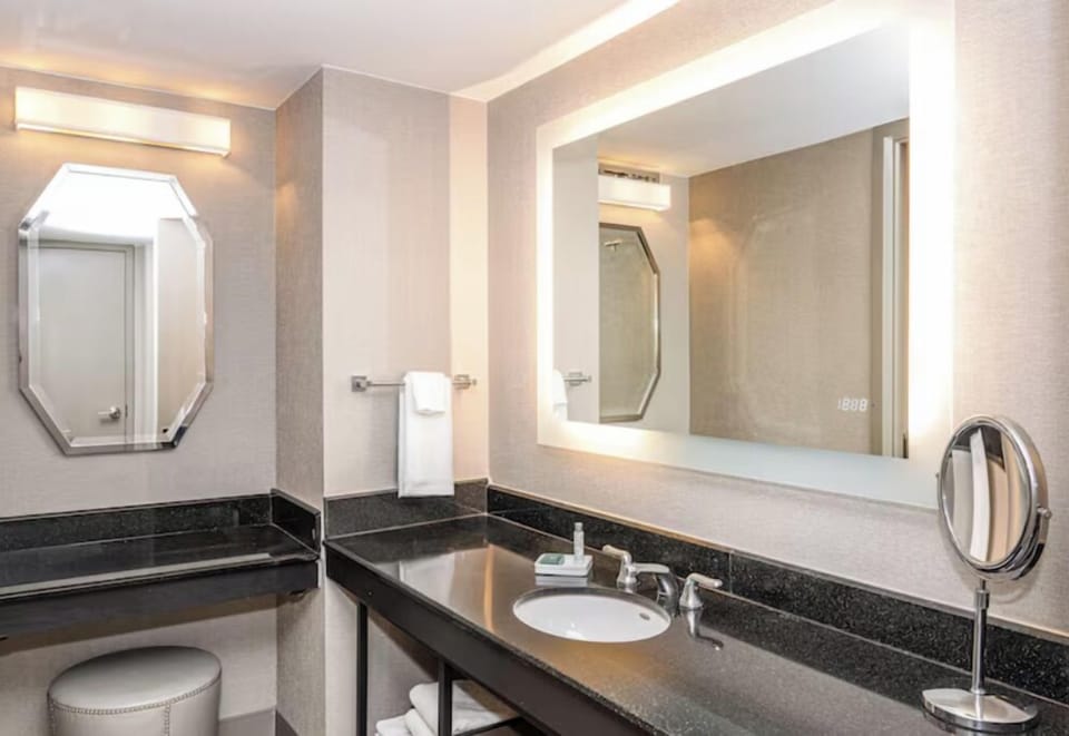 Refresh at the sleek vanity with bright, flattering lighting.