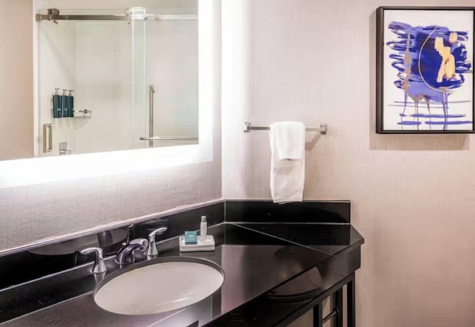 Refresh effortlessly at the sleek vanity with bright, flattering lighting