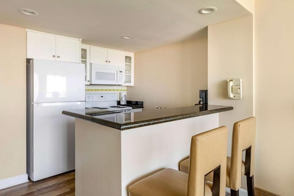 Cook with ease in the bright kitchen with breakfast bar.