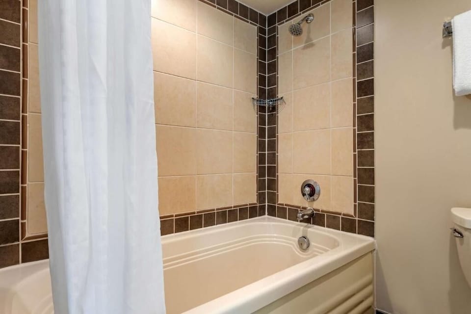 Refresh after the beach with a clean, tiled shower-tub.