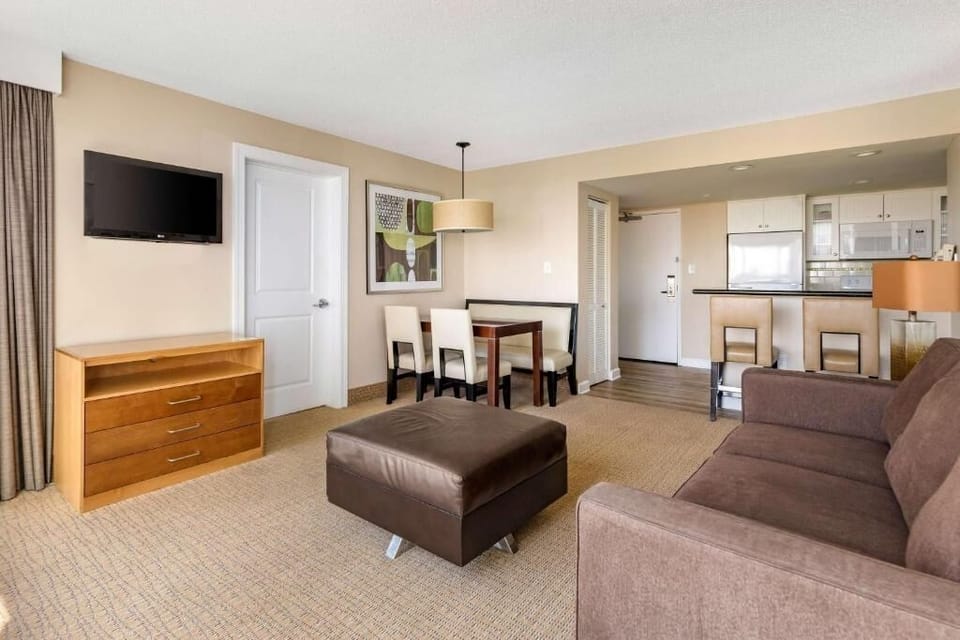 Gather for meals and relax in this open, airy suite.