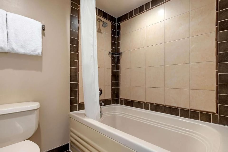 Refresh after the beach in a clean tub-and-shower combo.