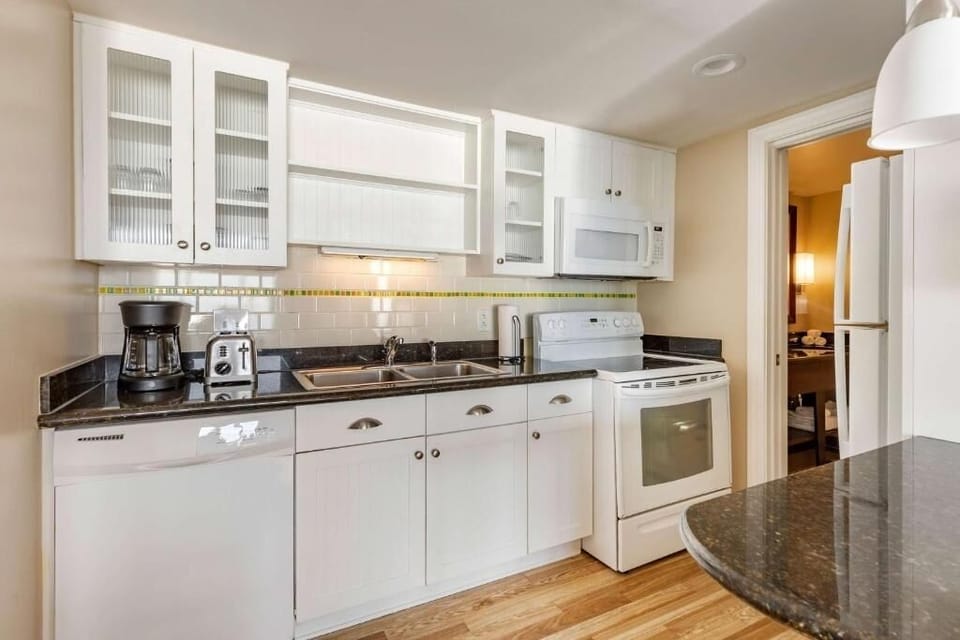 Start mornings with coffee in a crisp, well-equipped kitchenette.