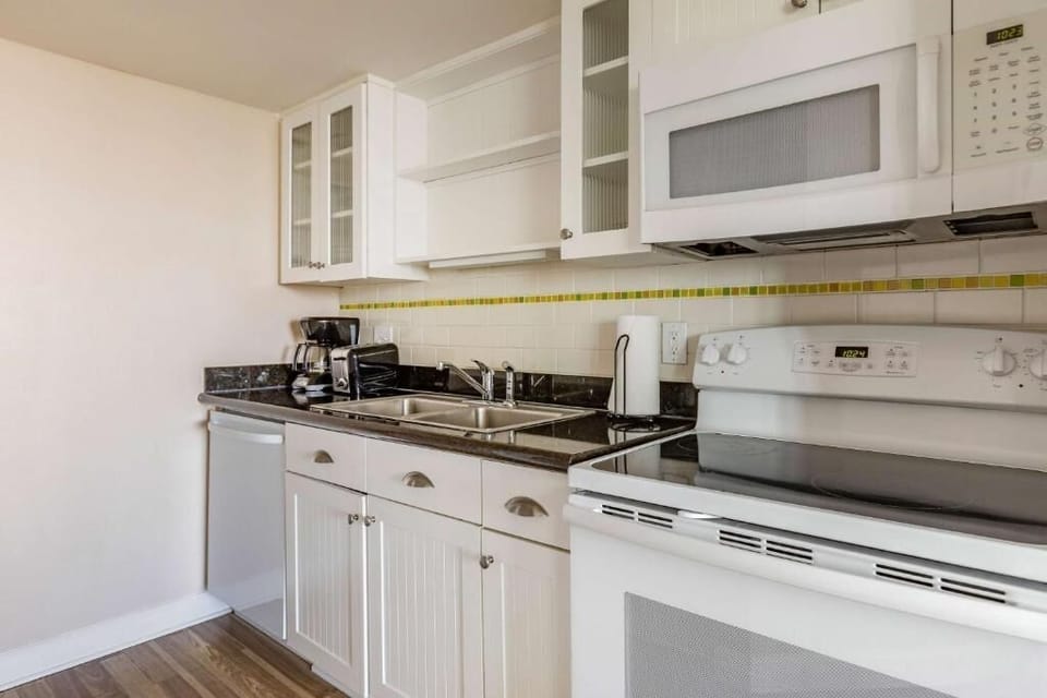 Cook simple meals with a full stove, microwave, and sink.