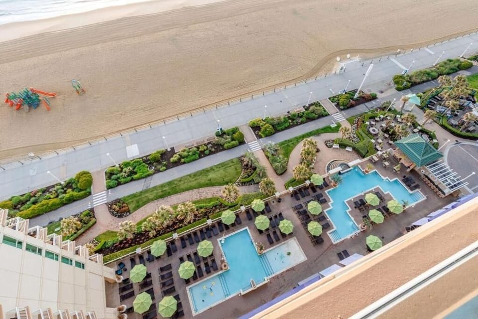 Soak up beachfront vibes with sweeping pools-and-shore views.