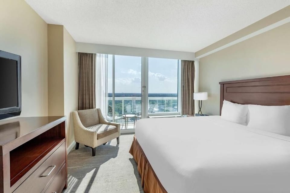 Wake up to sunlit views from your serene bedroom retreat.