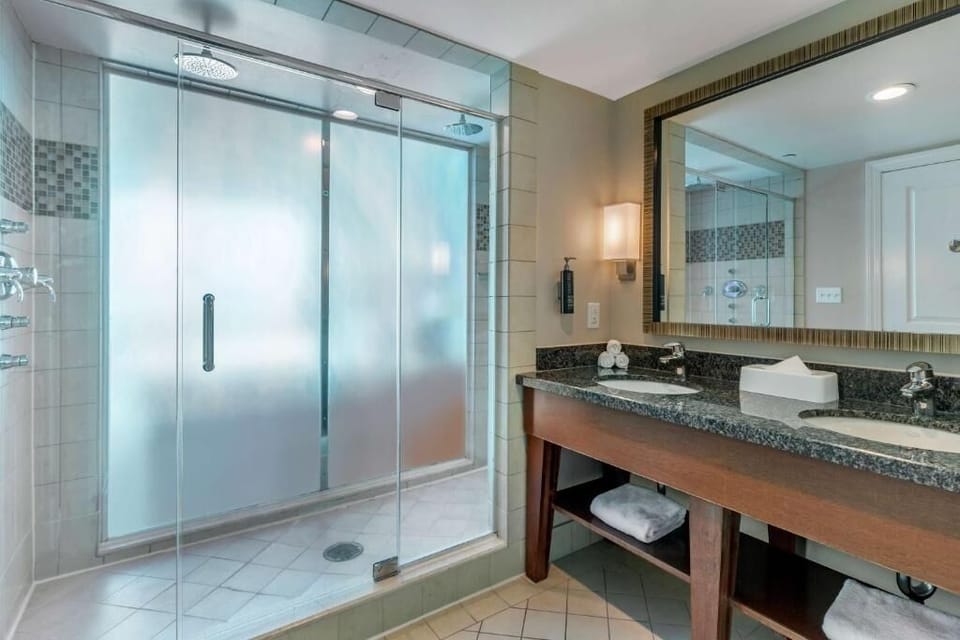 Refresh under the roomy glass shower and spa-like lighting.