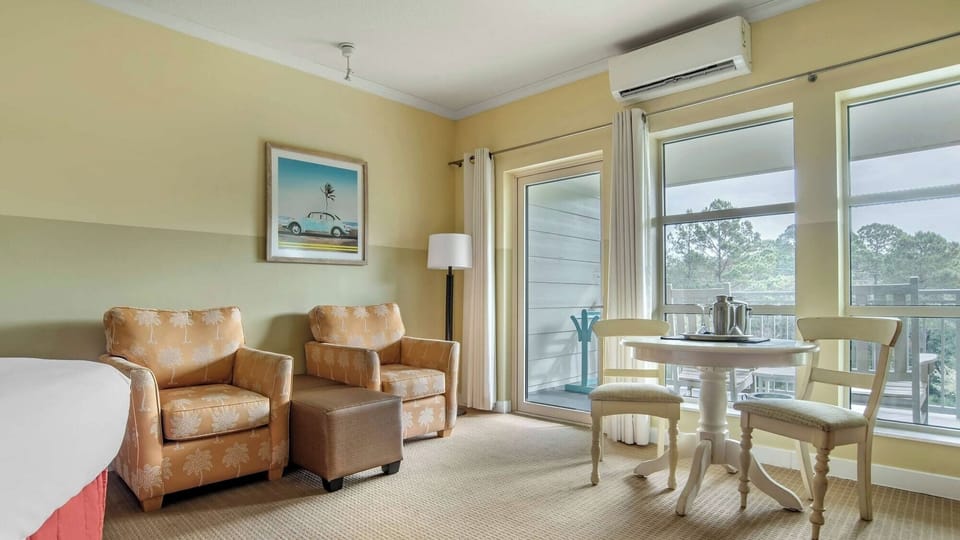 Sip morning coffee by sunny doors opening to balcony.