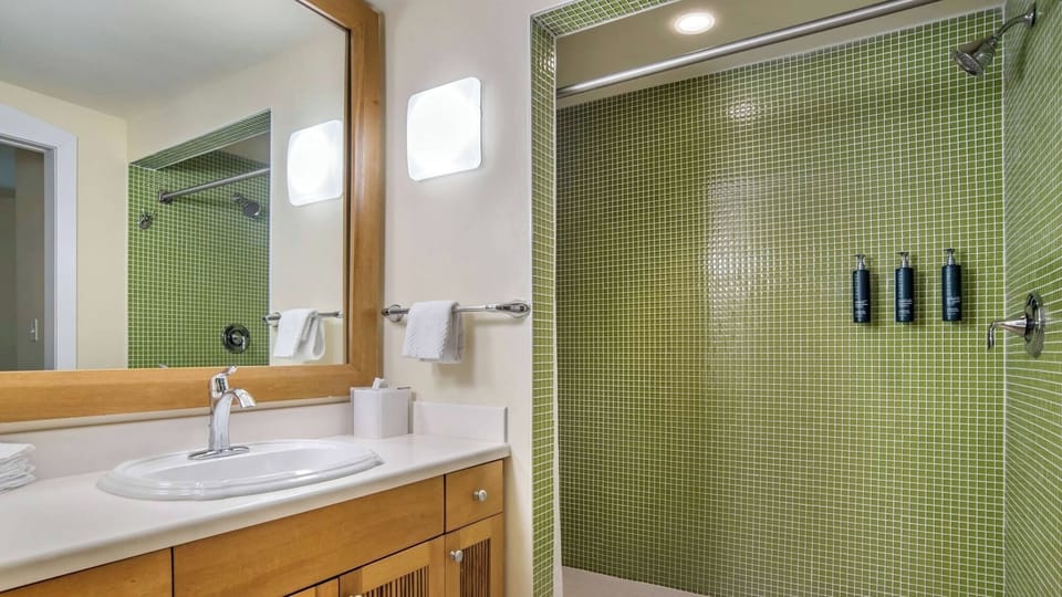 Refresh under a spacious shower with bright, clean finishes.