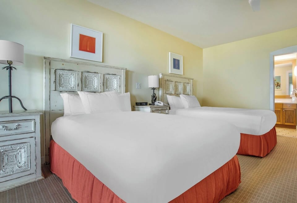 Settle into crisp twin queens for effortless group-friendly sleep.