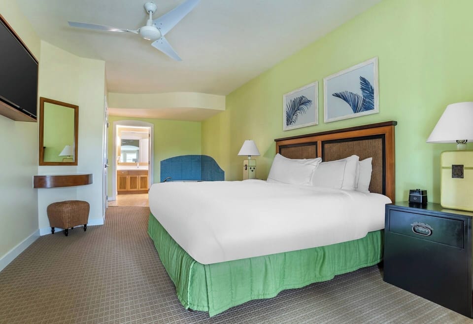 Stretch out in a serene king bed with ceiling fan.