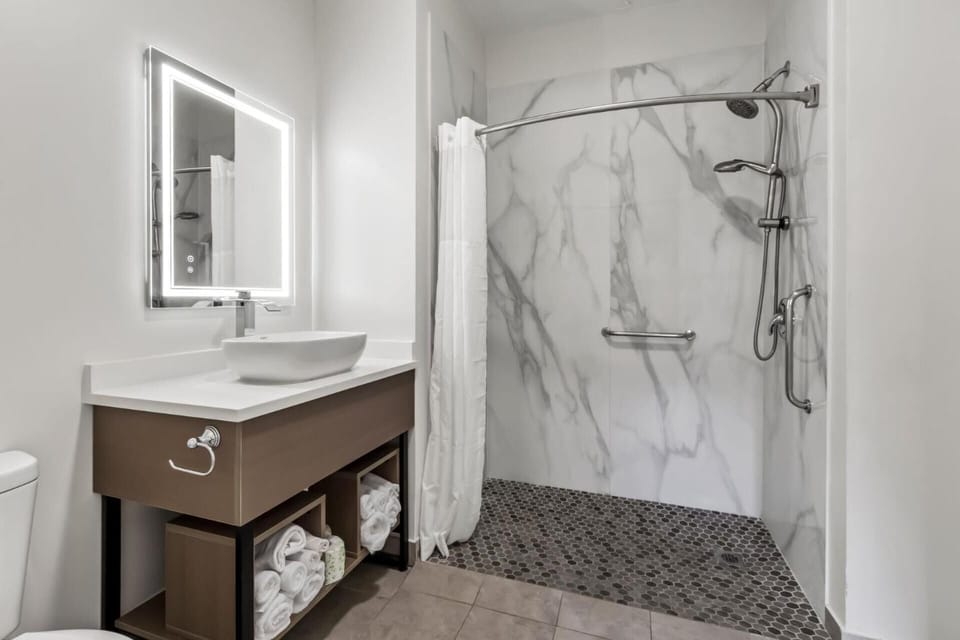 Rinse off comfortably with spa-like finishes and roomy shower space.