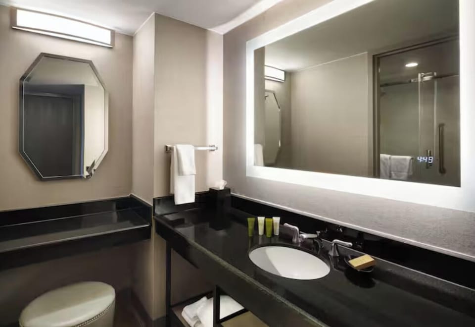 Refresh at the sleek vanity with bright, flattering lighting.