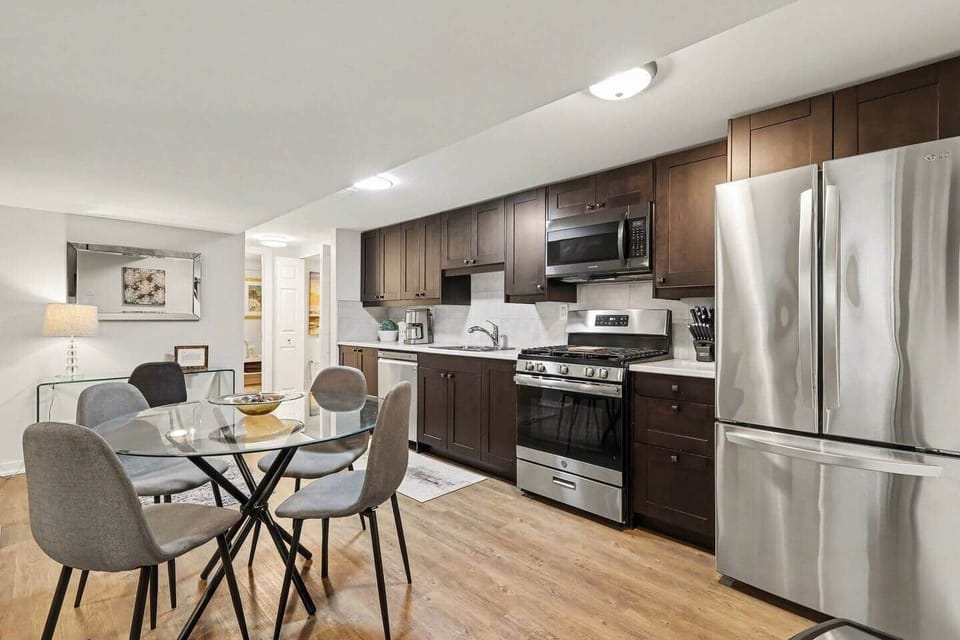 Another look at the high-end kitchen, highlighting the convenient layout and modern cabinetry. Perfect for midterm stays in Ottawa.