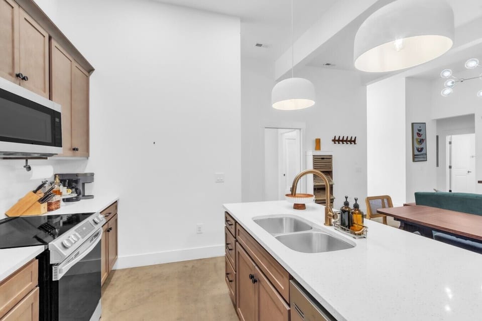 Open kitchen with dining and living area flow