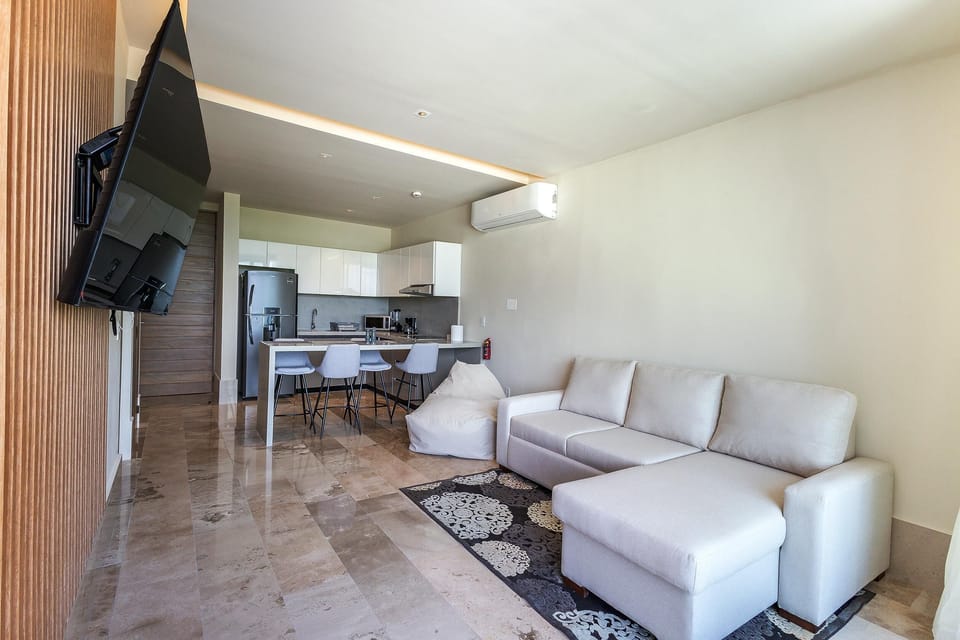 Cozy living room with plush seating and entertainment setup