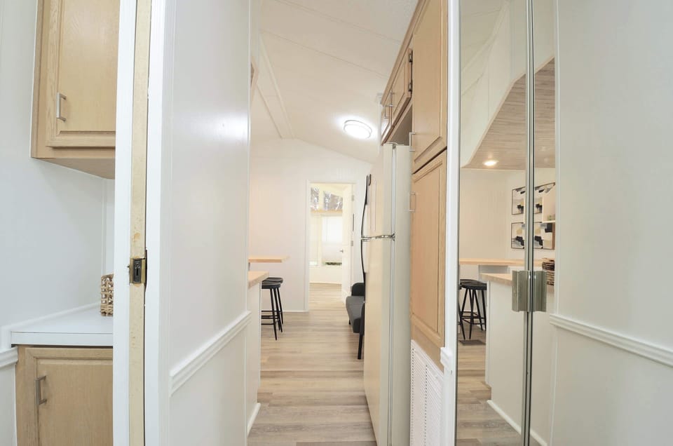 Hallway w/ clean design & easy access to multiple rooms throughout the home