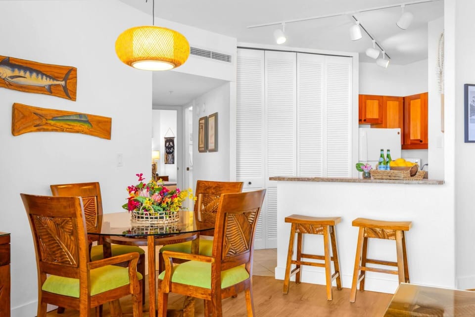 Gather around the dining table for memorable meals with tropical island ambiance