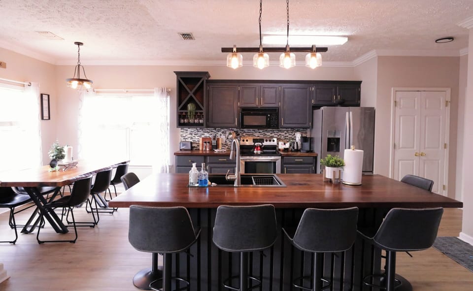 walnut countertop with seating for 6 for gathering with friends and family.