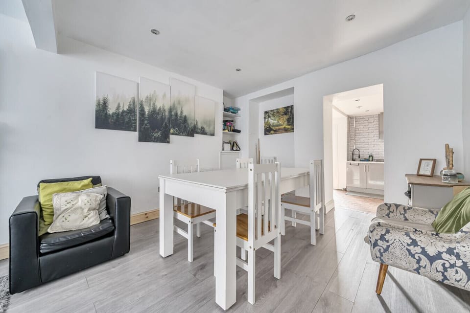 Bright dining area flows into the sitting room, perfect for sharing meals and stories after a day outdoors.