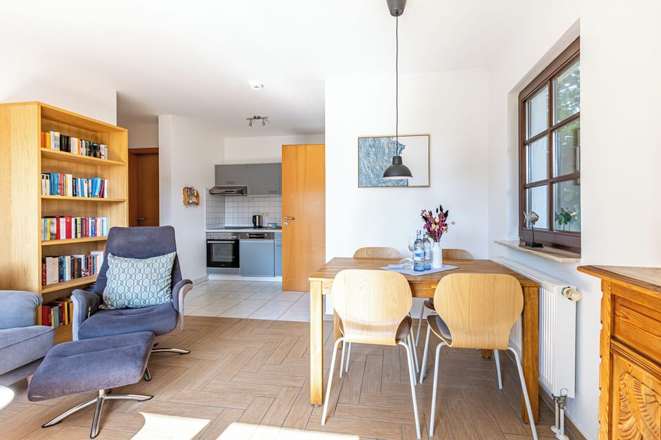 Cozy Living Room with Dining Table and Reading Chair
