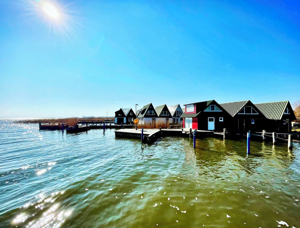 Exterior view of several holiday homes by the water