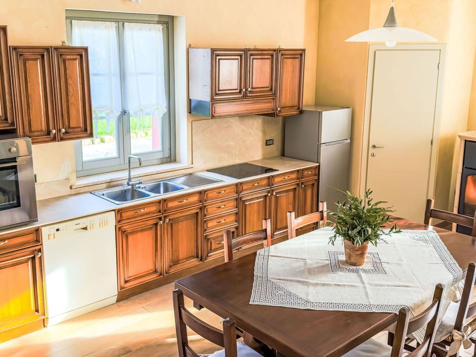 Furniture, Flooring, Kitchen, Interior Design, Wood, Cabinetry, Floor, Countertop, Major Appliance, Kitchen Appliance