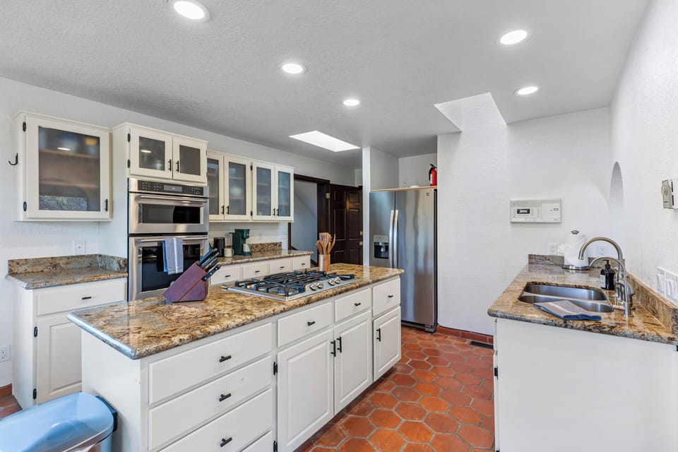 Well stocked bright kitchen.