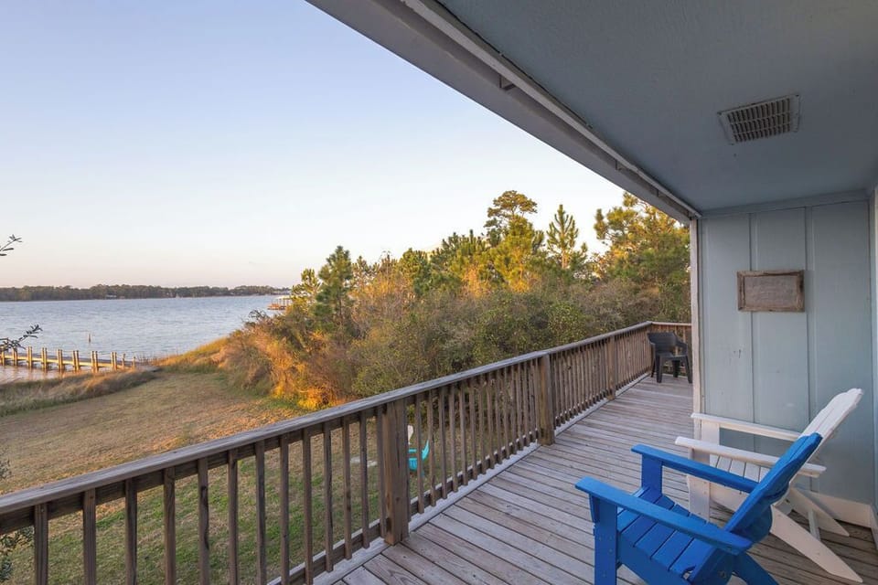 Balcony - Enjoy gorgeous Little Lagoon views from the spacious balcony, which includes comfortable, Poly-deck seating for convenience.