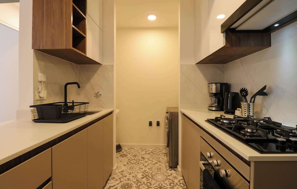 Fully equipped kitchen with coffee maker and essentials.