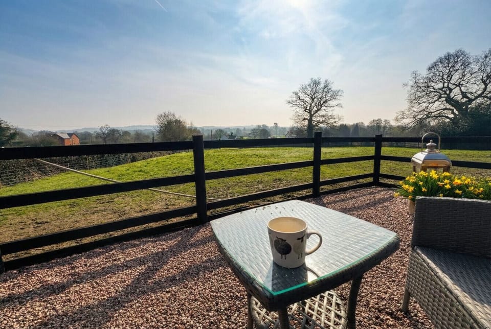 Sip morning coffee on your private terrace with sweeping countryside views.