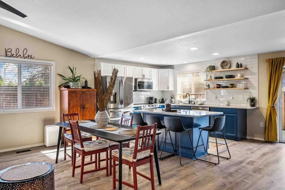 A bright dining area overlooking the kitchen, making it easy to gather and stay connected.