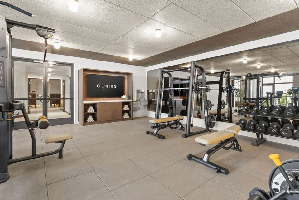 Smith machine, full dumbbell range, and an open floor for real strength work.