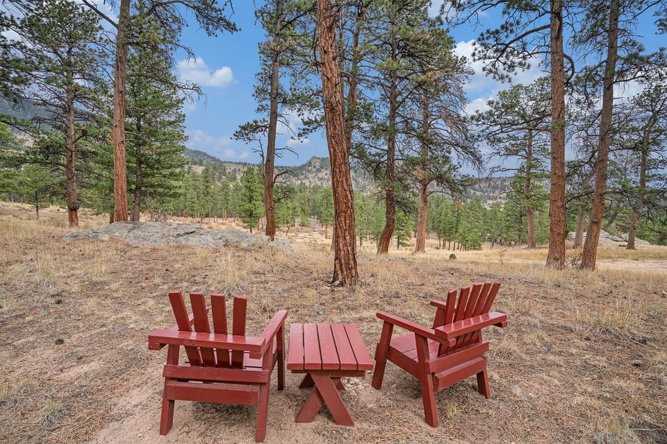Forest retreat with cozy Adirondack seating area