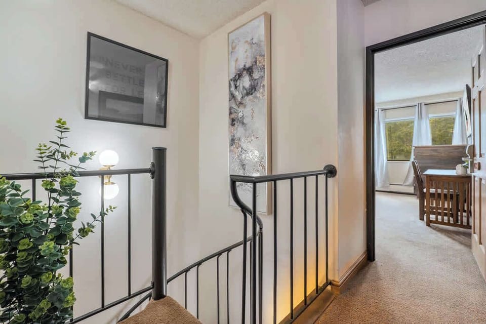 The attached spiral staircase adds a second access point from the entry hallway to add extra privacy for traveling couples.  A third, private or combined, suite is situated off the foyer at the base of the spiral stairs with lock off options.