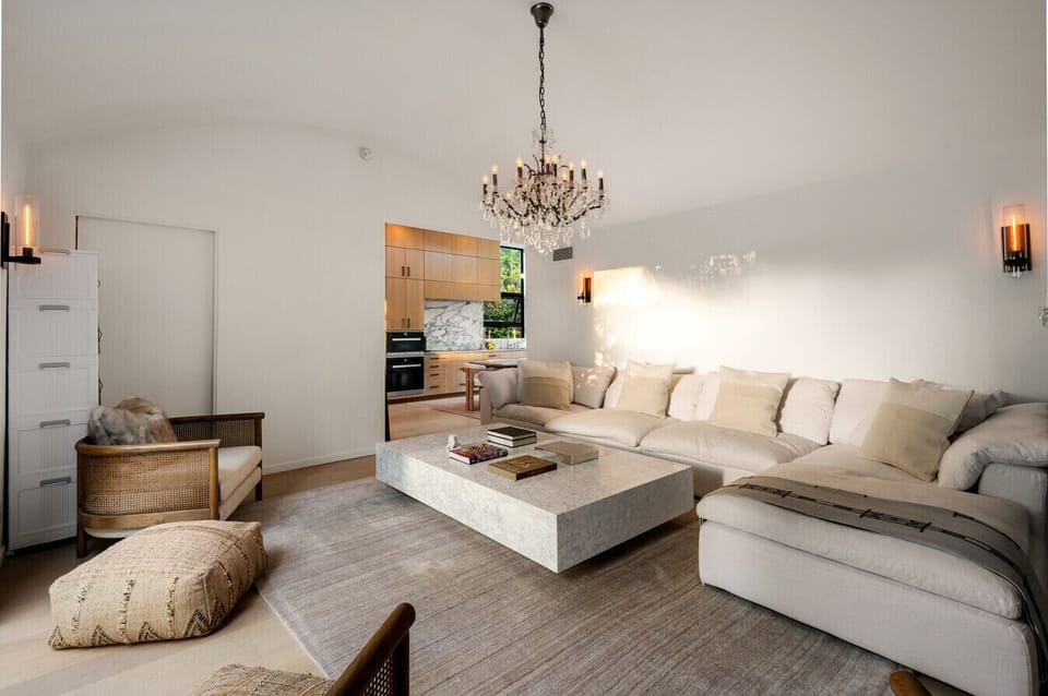 Sunlit, well-designed living room connecting effortlessly to your private pool oasis.