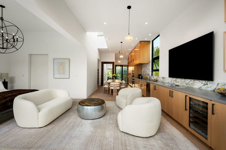 Modern, stylish living space perfect for relaxing or entertaining with floor-to-ceiling pocket doors.