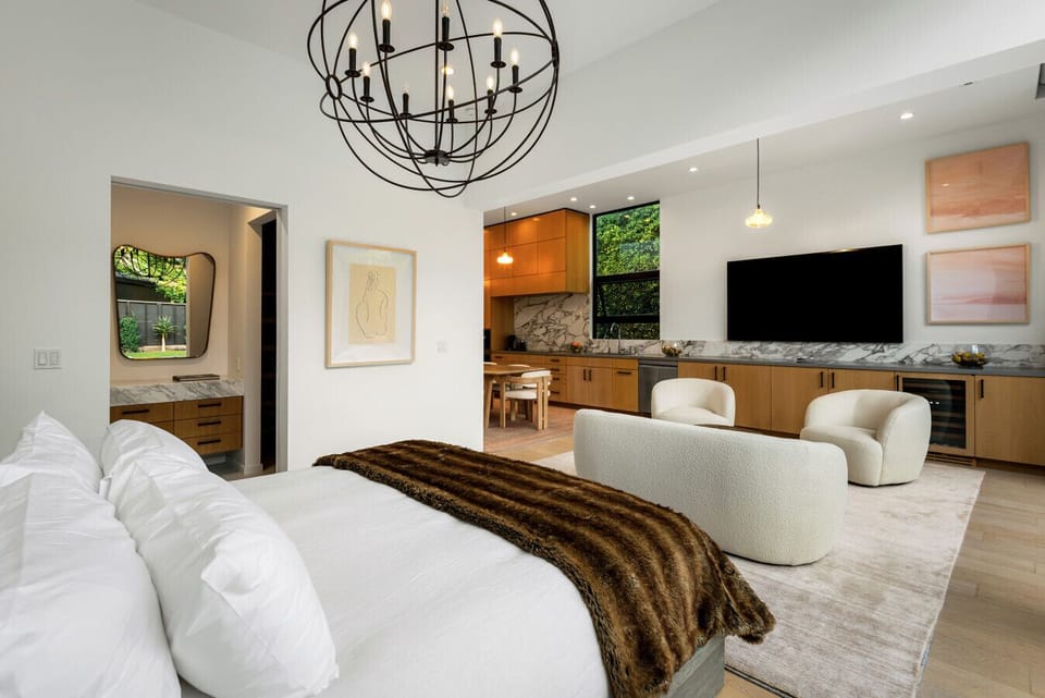 Meticulously designed bedroom with a pool view and serene ambiance.