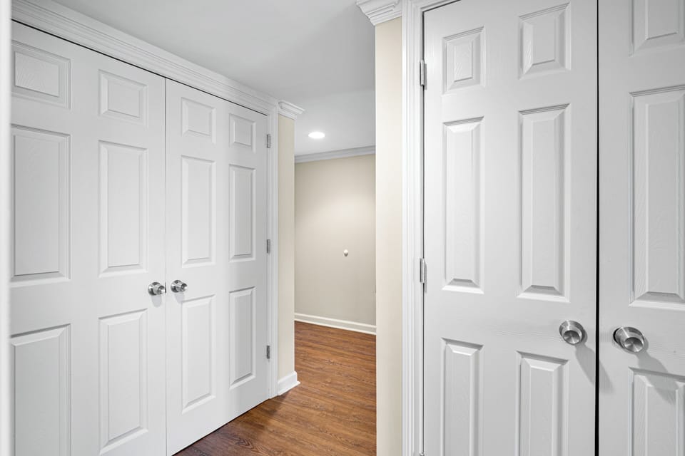 Bright hallway with ample storage and closet space, offering convenient organization for beach gear, luggage, and personal items during your stay.