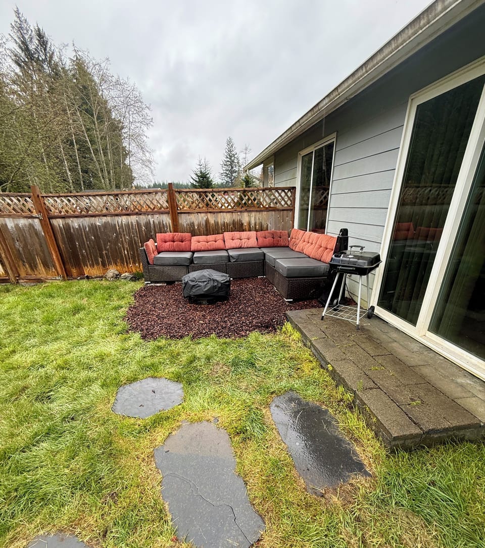Outdoor seating area with bbq and fire pit